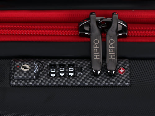 Recessed TSA-approved combination lock with HIPPO-engraved zip pulls on the red zip